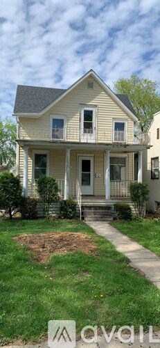 A two-story house with a front porch.