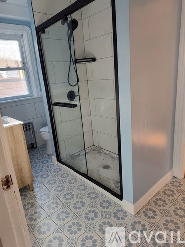 A bathroom with blue walls and a white sink.