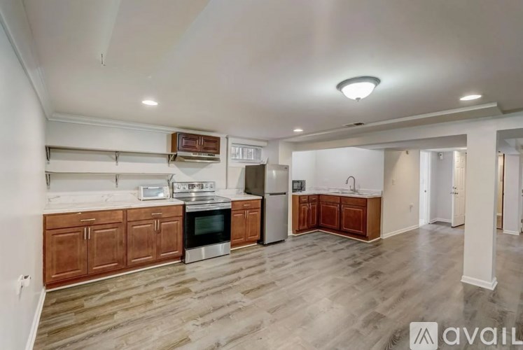 A kitchen with wooden cabinets and a white fridge.