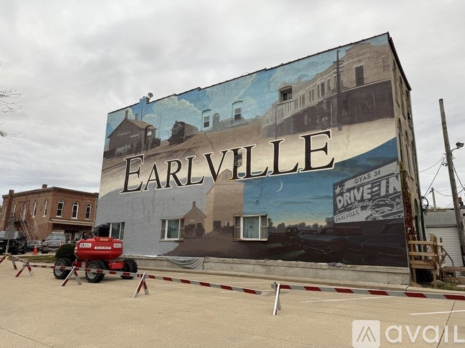 A large mural on a building wall with the word "EARLVILLE" written on it.