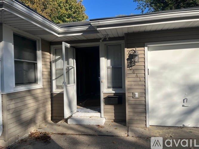 A house with a closed door and open window.