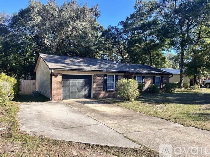 A detached house with a garage and a driveway.