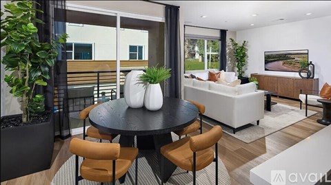 A modern living room with a black table and chairs.