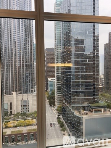 A view of a cityscape through a window.