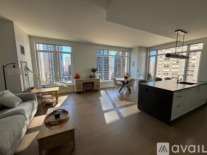 A modern living room with a large window overlooking the city.