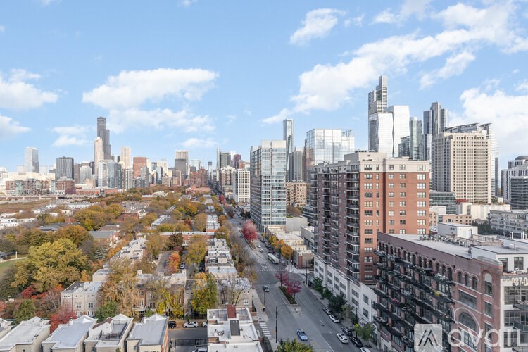 A cityscape with tall buildings and a clear sky.
