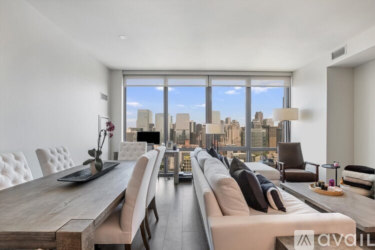 A modern living room with a view of the city skyline.