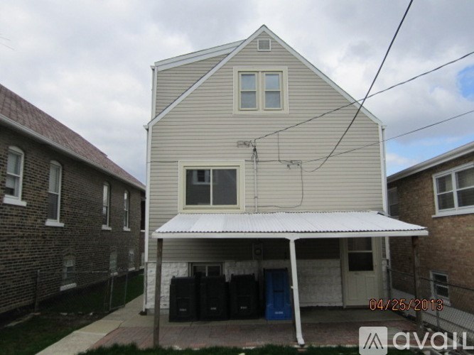 A house with a garage and a carport is for sale.