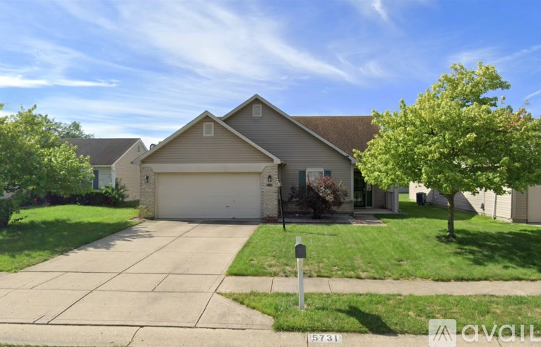 A house with a garage is for sale.