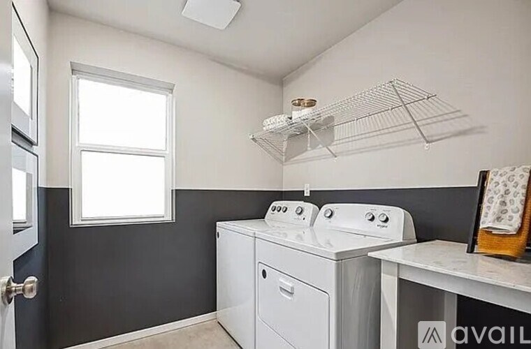 A laundry room with a washer and dryer.
