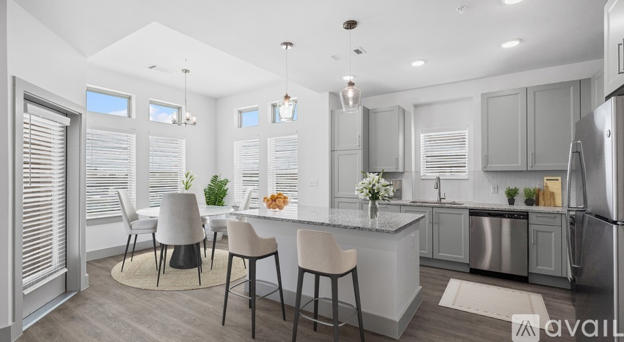 A modern kitchen with a dining table set up.