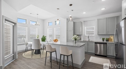 A modern kitchen with a dining table set up.