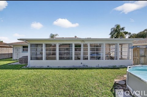 A house with a pool in the backyard.