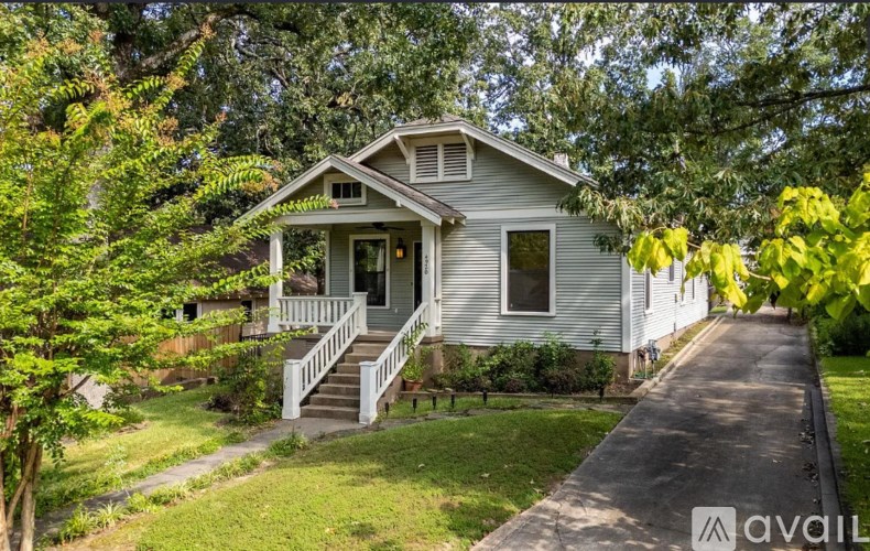 A house with a front porch and a driveway.