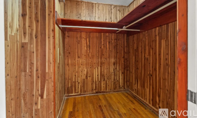 A room with wooden walls and floor.