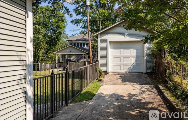 A house with a garage is for sale.