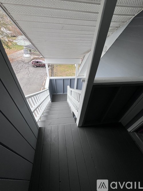 A view from the inside of a house looking out to a deck.