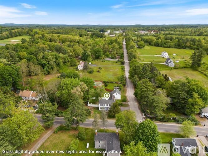 A bird's eye view of a residential area with houses and trees.