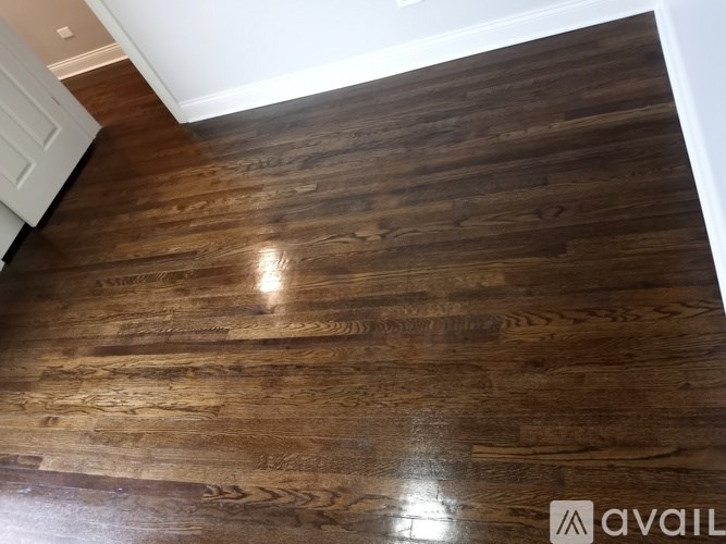 A wooden floor with a logo that says "AVAIL" on it.