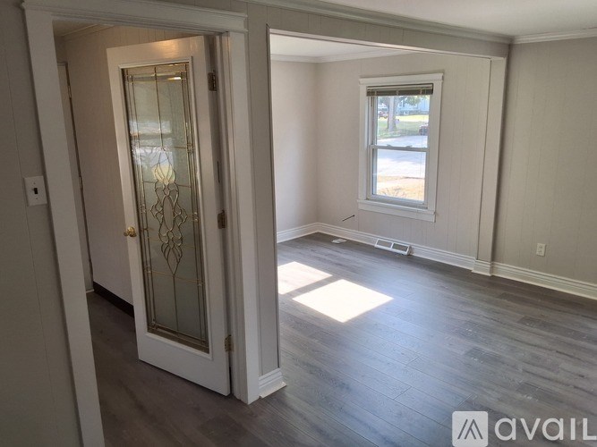 A room with a door and a window.