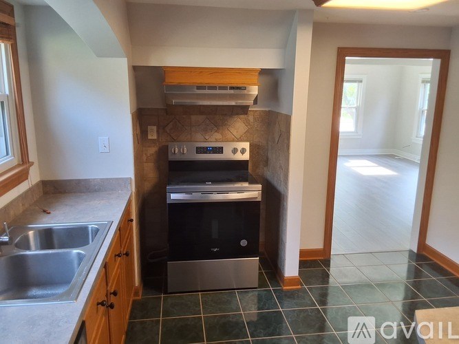 A kitchen with a stove, oven, and dishwasher.