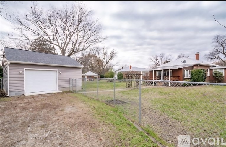 A house with a garage is for sale.