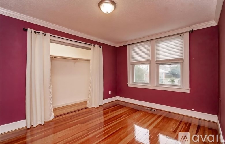 A room with a window and a sliding door.