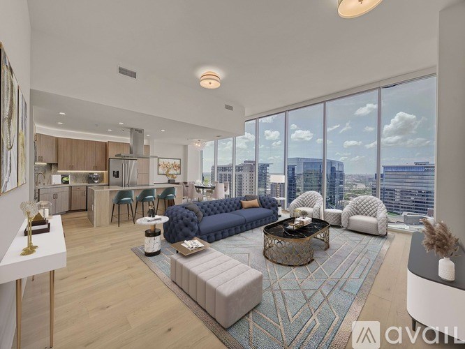 A modern living room with a large window overlooking the city.