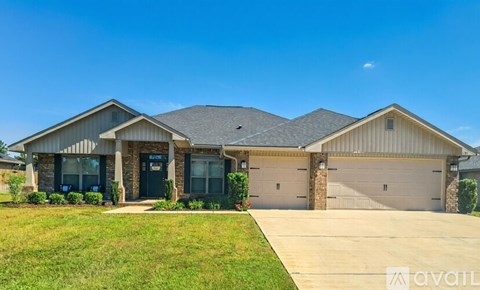 A house with a grey roof and a garage door.