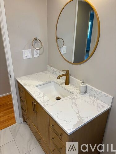 A room with a wooden floor and a ceiling fan.