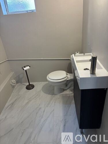 A white double door with a black handle is closed.