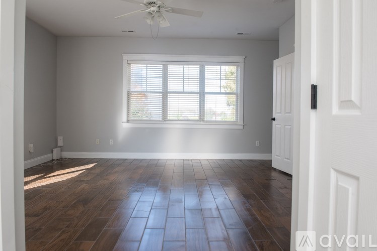 A bathroom with a toilet, sink, and shower.