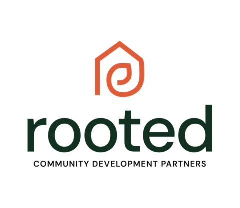The image shows a logo with the word "rooted" in green and a tagline "COMMUNITY DEVELOPMENT PARTNERS" beneath it.