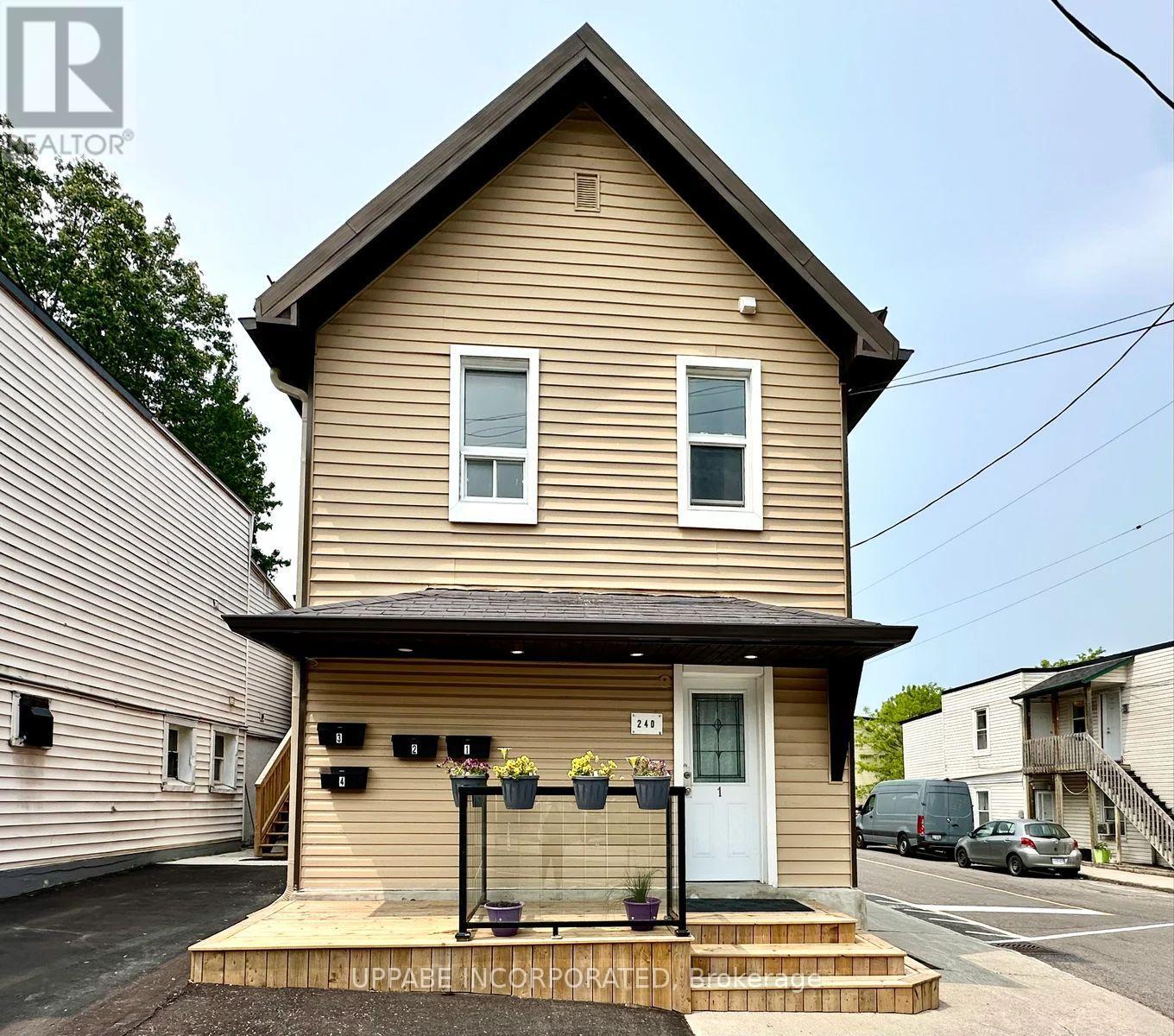 A house with a front porch and a white door.