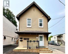 A house with a front porch and a white door.