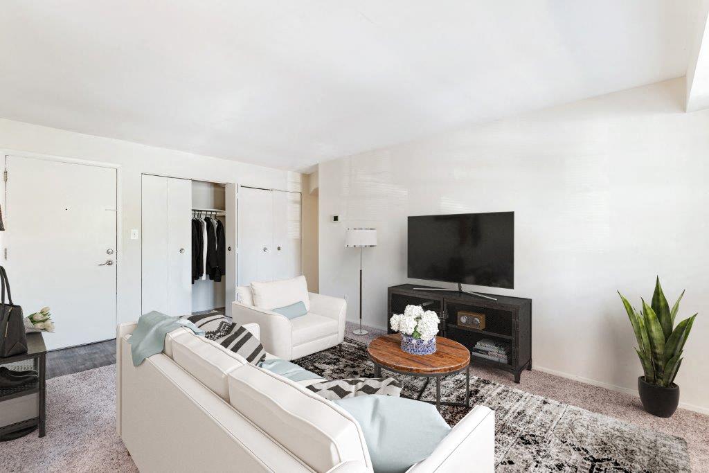 Staged living room with carpet throughout