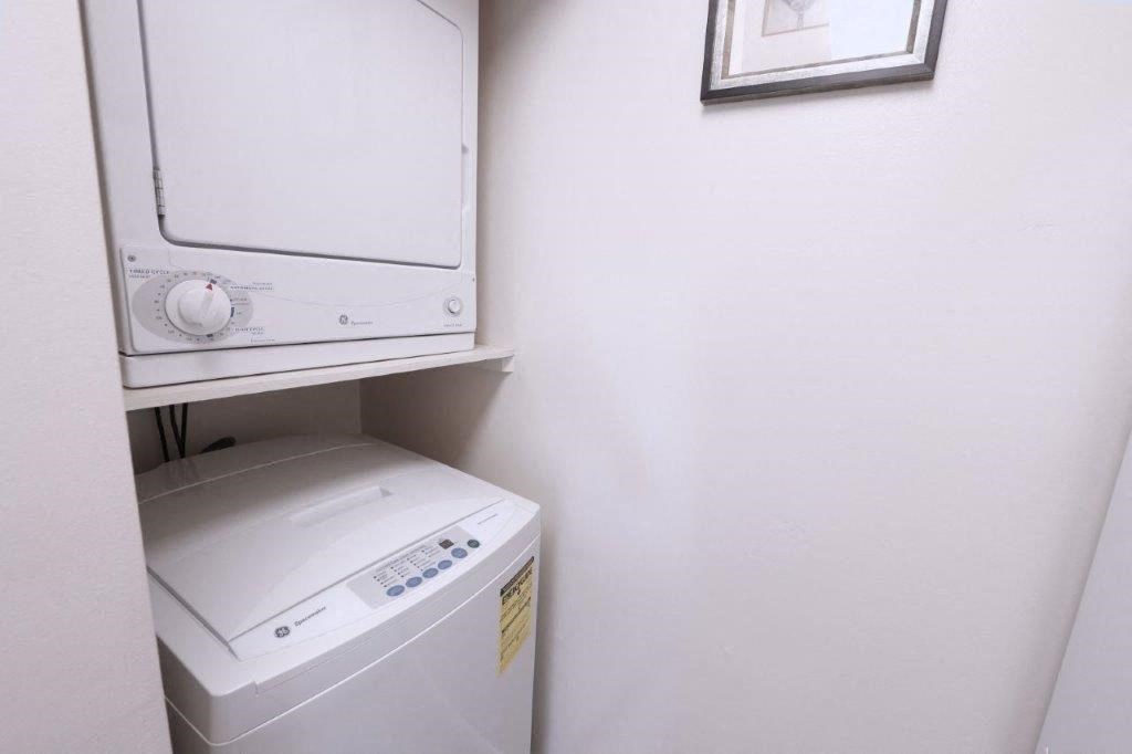 a white washer and dryer in a white room