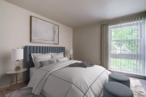 a bedroom with a large bed and a window