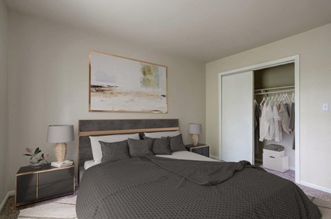 a bedroom with a large bed and a closet