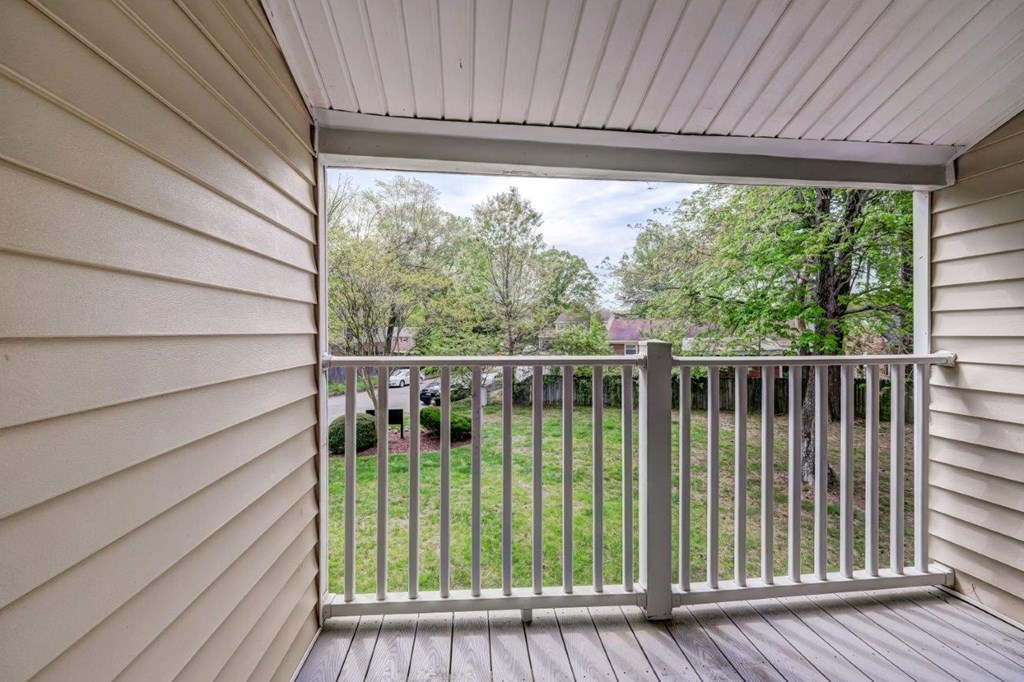 a view of the yard from the deck of a home
