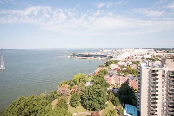 an aerial view of a city with a harbor and a body of water