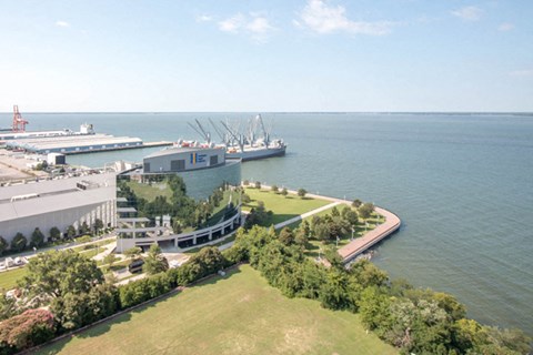 an aerial view of a convention center and a body of water