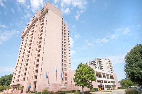 a large building with a blue sky in the background