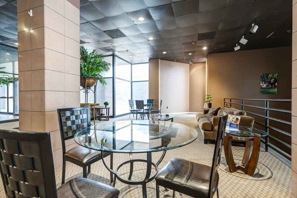 a conference room with a glass table and chairs