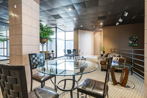 a conference room with a glass table and chairs