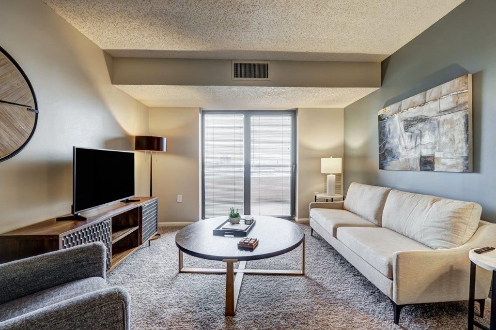 a living room with a couch and a table