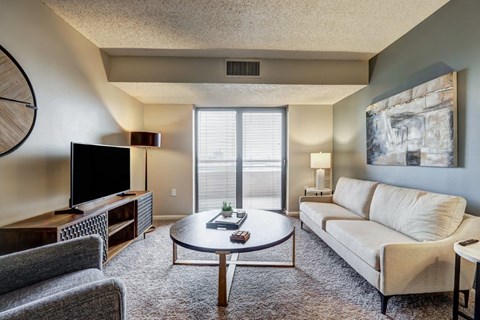 a living room with a couch and a table