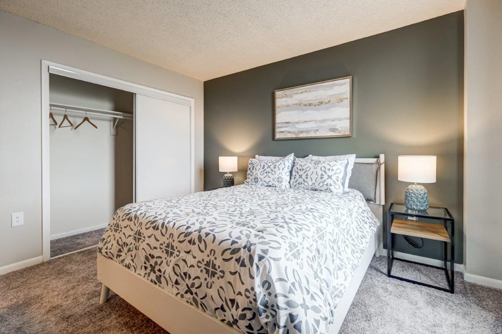 a bedroom with a bed and a closet