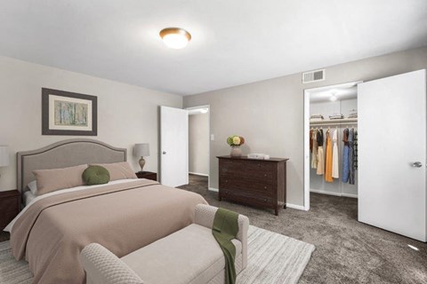 a bedroom with a bed and a closet