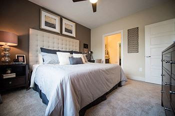 Carpet-flooring-in-bedroom at Link Apartments® Brookstown, Winston Salem, North Carolina